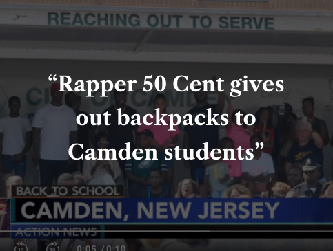 Rapper 50 Cent gives out backpacks to Camden students