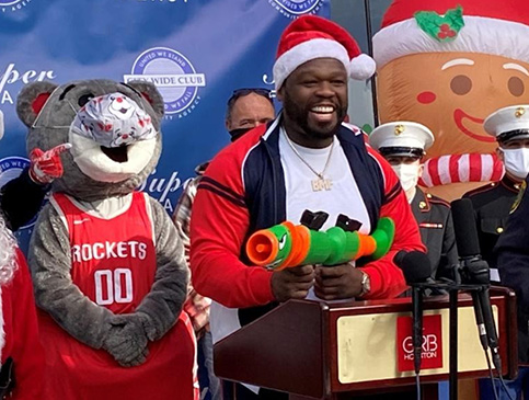 Curtis helps Super Feast toy drive in Houston.